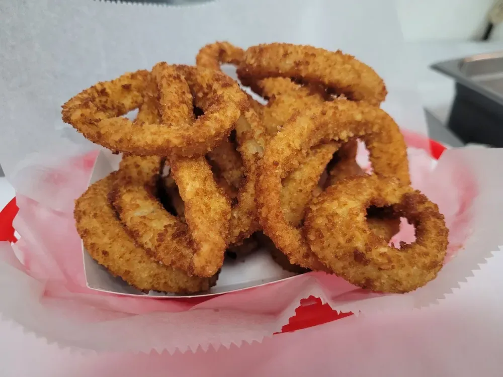 Homestyle onion rings in a paper boat