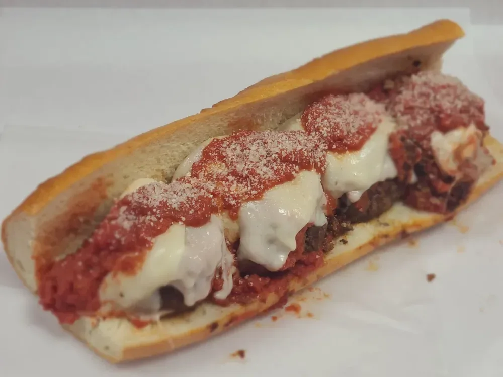 The Meatball Parm with hand-rolled meatballs, marinara, melted provolone, and grated Parmesan on a fresh Italian roll