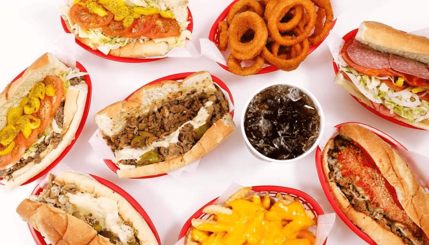 Amato's catering spread with cheesesteaks, hoagies, and sides